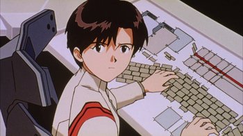 Movie still from “Neon Genesis Evangelion: Death & Rebirth” (1997), directed by Tensai Okamura – A boy is using a computer keyboard in front of a table; Close Up shot, High angle
