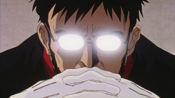 Movie still from “Neon Genesis Evangelion: Death & Rebirth” (1997), directed by Tensai Okamura – A person's face with glowing eyes; Extreme Close Up shot, Low angle