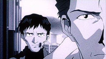 Movie still from “Neon Genesis Evangelion: Death & Rebirth” (1997), directed by Tensai Okamura – A black - and - white image of a man and a woman; Close Up shot, Low angle