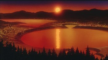 Movie still from “Neon Genesis Evangelion: Death & Rebirth” (1997), directed by Tensai Okamura – The sun is setting over a body of water; Extreme Wide shot, High angle