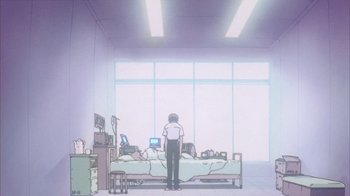 Movie still from “Neon Genesis Evangelion: Death & Rebirth” (1997), directed by Tensai Okamura – A person standing in front of a bed in a room; Wide shot, Low angle