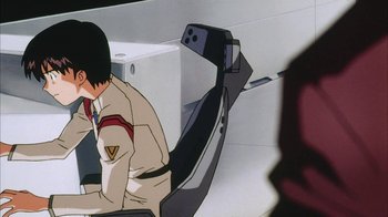 Movie still from “Neon Genesis Evangelion: Death & Rebirth” (1997), directed by Tensai Okamura – An animated scene of a man sitting in a chair; Close Up shot, High angle
