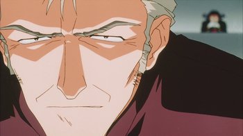 Movie still from “Neon Genesis Evangelion: Death & Rebirth” (1997), directed by Tensai Okamura – An animated picture of a man's face with his eyes closed; Extreme Close Up shot, Low angle