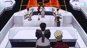 Movie still from “Neon Genesis Evangelion: Death & Rebirth” (1997), directed by Tensai Okamura – A group of people sitting around a table; Wide shot, High angle