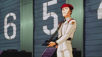 Movie still from “Neon Genesis Evangelion: Death & Rebirth” (1997), directed by Tensai Okamura – A man holding a gun in front of a number five sign; Medium shot, Low angle