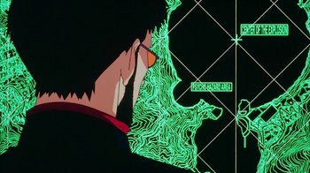 Movie still from “Neon Genesis Evangelion: Death & Rebirth” (1997), directed by Tensai Okamura – A person is drawing a map on a wall; Extreme Close Up shot, Overhead angle