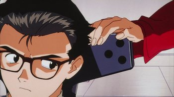 Movie still from “Neon Genesis Evangelion: Death & Rebirth” (1997), directed by Tensai Okamura – A cartoon of a person combing another person's hair; Extreme Close Up shot, Overhead angle