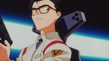 Movie still from “Neon Genesis Evangelion: Death & Rebirth” (1997), directed by Tensai Okamura – A person wearing glasses and a jacket; Close Up shot, Low angle