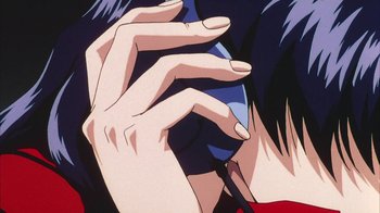 Movie still from “Neon Genesis Evangelion: Death & Rebirth” (1997), directed by Tensai Okamura – View of a woman's hands and fingers; Extreme Close Up shot, Overhead angle