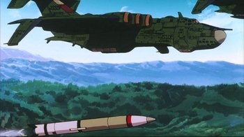 Movie still from “Neon Genesis Evangelion: Death & Rebirth” (1997), directed by Tensai Okamura – An image of an airplane flying over a forest; Extreme Wide shot, Low angle