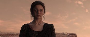 Movie still from “Gangubai Kathiawadi” (2022), directed by Sanjay Leela Bhansali – A woman in a black dress and a black veil; Close Up shot, Low angle