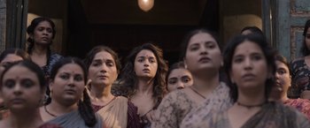 Movie still from “Gangubai Kathiawadi” (2022), directed by Sanjay Leela Bhansali – A group of women standing next to each other; Medium shot, Low angle