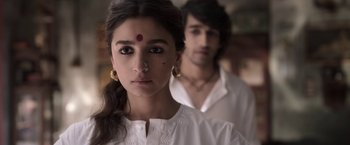 Movie still from “Gangubai Kathiawadi” (2022), directed by Sanjay Leela Bhansali – A woman and a man standing next to each other; Close Up shot, Over the shoulder angle