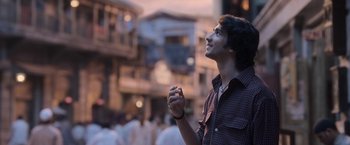 Movie still from “Gangubai Kathiawadi” (2022), directed by Sanjay Leela Bhansali – A man standing in the middle of a street; Close Up shot, Low angle