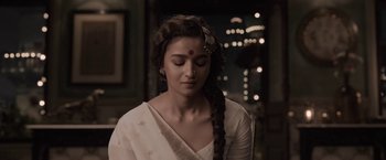 Movie still from “Gangubai Kathiawadi” (2022), directed by Sanjay Leela Bhansali – A young woman with her eyes closed and her head tilted to the side; Close Up shot, High angle