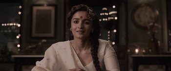 Movie still from “Gangubai Kathiawadi” (2022), directed by Sanjay Leela Bhansali – A person wearing a white shirt; Close Up shot, Low angle