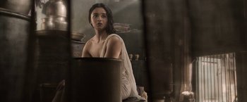 Movie still from “Gangubai Kathiawadi” (2022), directed by Sanjay Leela Bhansali – A woman in a white towel sitting in a room; Medium shot, High angle