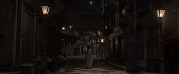 Movie still from “Gangubai Kathiawadi” (2022), directed by Sanjay Leela Bhansali – A man in a white robe walking down a street; Extreme Wide shot, High angle