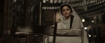 Movie still from “Gangubai Kathiawadi” (2022), directed by Sanjay Leela Bhansali – A young woman in a white dress and a veil; Medium shot, Low angle