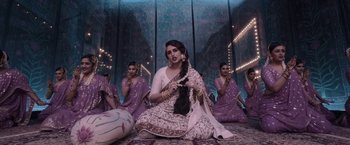 Movie still from “Gangubai Kathiawadi” (2022), directed by Sanjay Leela Bhansali – A group of women sitting on the floor in front of a wall; Medium shot, Over the shoulder angle