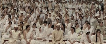 Movie still from “Gangubai Kathiawadi” (2022), directed by Sanjay Leela Bhansali – A large group of people sitting in a large group; Wide shot, High angle
