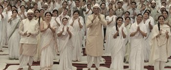 Movie still from “Gangubai Kathiawadi” (2022), directed by Sanjay Leela Bhansali – A large group of people wearing white clothes; Wide shot, High angle