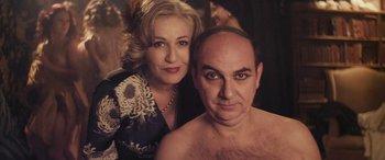 Movie still from “Neruda” (2016), directed by Pablo Larraín – A man and a woman pose for a picture; Close Up shot, High angle