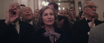 Movie still from “Neruda” (2016), directed by Pablo Larraín – A group of people standing in front of a crowd; Close Up shot, Low angle