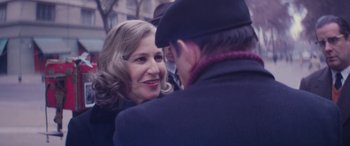 Movie still from “Neruda” (2016), directed by Pablo Larraín – A woman and a man talking to each other; Close Up shot, Over the shoulder angle