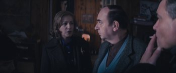 Movie still from “Neruda” (2016), directed by Pablo Larraín – A man and a woman standing next to each other in a room; Medium shot, Over the shoulder angle