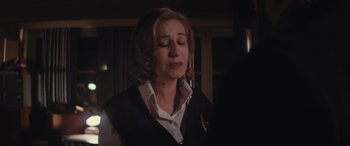 Movie still from “Neruda” (2016), directed by Pablo Larraín – A woman in a black vest and a white shirt; Close Up shot, Over the shoulder angle