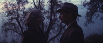 Movie still from “Neruda” (2016), directed by Pablo Larraín – A man and a woman talking to each other outside; Medium shot, Over the shoulder angle
