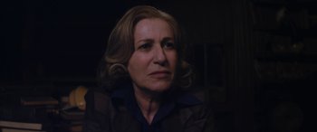 Movie still from “Neruda” (2016), directed by Pablo Larraín – A person looking at the camera; Close Up shot, Over the shoulder angle