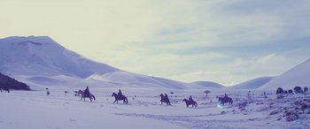 Movie still from “Neruda” (2016), directed by Pablo Larraín – A group of people riding horses through the snow; Extreme Wide shot, Low angle
