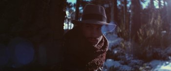Movie still from “Neruda” (2016), directed by Pablo Larraín – A man wearing a hat and scarf in the snow; Close Up shot, Low angle