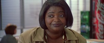 Movie still from “Never Been Kissed” (1999), directed by Raja Gosnell – A person with short black hair; Close Up shot, High angle