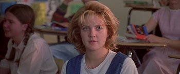 Movie still from “Never Been Kissed” (1999), directed by Raja Gosnell – A young woman with blonde hair wearing a white shirt; Close Up shot, Low angle