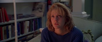 Movie still from “Never Been Kissed” (1999), directed by Raja Gosnell – A woman with blonde hair and a blue sweater; Close Up shot, Low angle