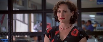 Movie still from “Never Been Kissed” (1999), directed by Raja Gosnell – A person wearing a necklace; Close Up shot, Over the shoulder angle