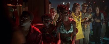 Movie still from “Never Been Kissed” (1999), directed by Raja Gosnell – A group of people standing in front of a window; Medium shot, Low angle