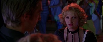 Movie still from “Never Been Kissed” (1999), directed by Raja Gosnell – A woman in a black dress and a man in a black shirt; Close Up shot, Over the shoulder angle