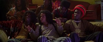 Movie still from “Never Been Kissed” (1999), directed by Raja Gosnell – A group of people sitting on a couch; Medium shot, High angle