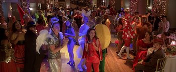 Movie still from “Never Been Kissed” (1999), directed by Raja Gosnell – A group of people dressed in costumes at a halloween party; Wide shot, High angle