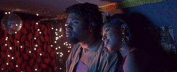 Movie still from “Never Been Kissed” (1999), directed by Raja Gosnell – A man and a woman standing next to each other; Close Up shot, Low angle