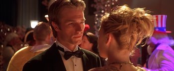 Movie still from “Never Been Kissed” (1999), directed by Raja Gosnell – A person wearing a suit and a bow tie; Close Up shot, Over the shoulder angle