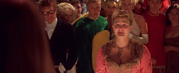 Movie still from “Never Been Kissed” (1999), directed by Raja Gosnell – A group of people standing in a room; Medium shot, Over the shoulder angle