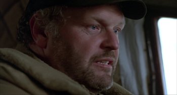 Movie still from “Never Cry Wolf” (1983), directed by Carroll Ballard – A person wearing a hat; Close Up shot, Low angle