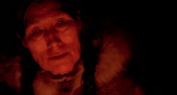 Movie still from “Never Cry Wolf” (1983), directed by Carroll Ballard – An older woman with a fur coat and a braid in her hair; Close Up shot, Low angle