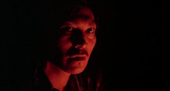 Movie still from “Never Cry Wolf” (1983), directed by Carroll Ballard – A person in a dark room; Close Up shot, Low angle
