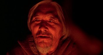 Movie still from “Never Cry Wolf” (1983), directed by Carroll Ballard – An old man with long blonde hair and a beard; Close Up shot, Low angle